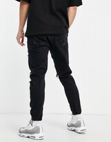 Thumbnail for your product : Bershka tapered jeans in washed black