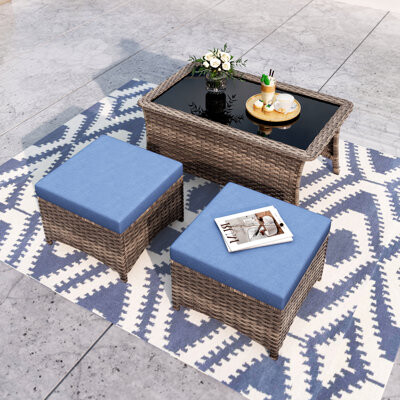 Alphamarts An Outdoor Patio Coffee Table & Two Ottomans