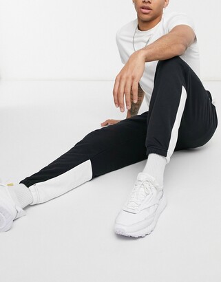 Reebok Training Essentials ll ft sweatpants in black with white panels -  ShopStyle Activewear Pants