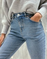 Thumbnail for your product : ASOS Petite DESIGN Petite high rise '70s stretch flare jeans in midwash
