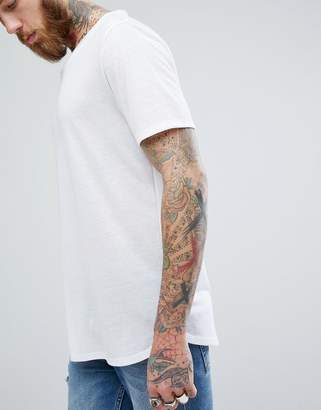 ASOS Design DESIGN relaxed longline t-shirt with raw scoop neck and curve hem in linen mix in white