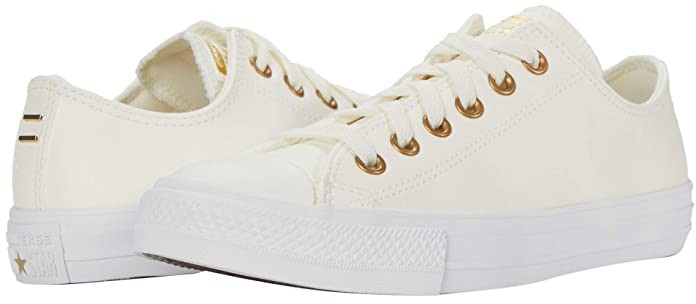 white and gold leather converse