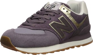 new balance womens black and gold