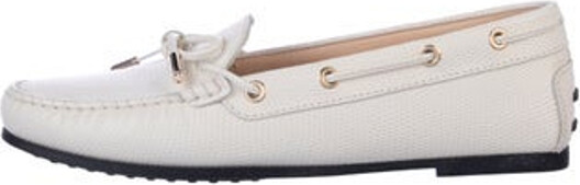 Tod's Leather Slip-On Sneakers White Round-Toes with Bow Accents Tie Closures Includes Box Unfortunately due to restrictions this item may not be eligible for shipping in all areas.