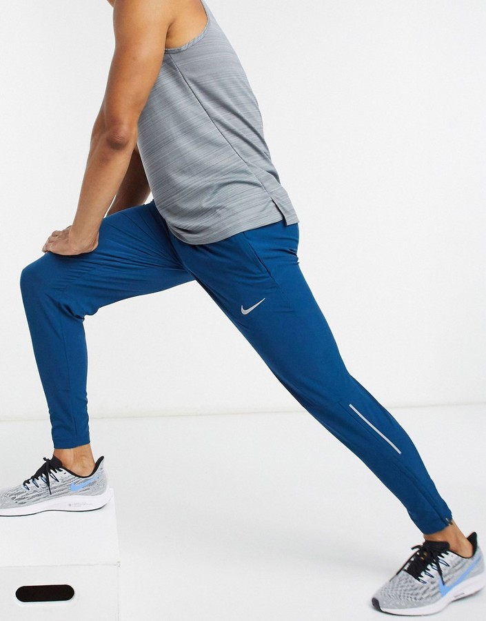 Nike Running Phenom Elite woven joggers in blue ShopStyle Trousers