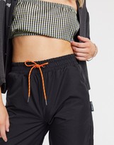 Thumbnail for your product : Collusion nylon sweatpants in black