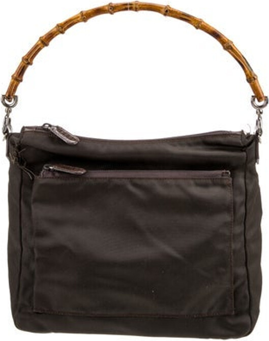 Gucci Shoulder Bag Black Nylon Bamboo Accent Silver-Tone Hardware Bamboo & Leather Trim Bamboo Handle Leather Trim Embellishment Logo Jacquard Lining Zip Closure at Top