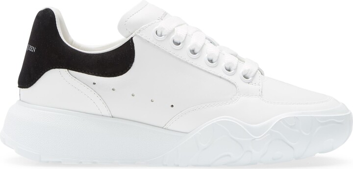 white sole black trainers