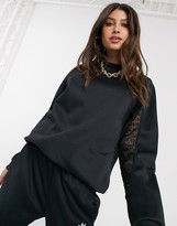 Thumbnail for your product : adidas Bellista lace insert oversized sweatshirt in black