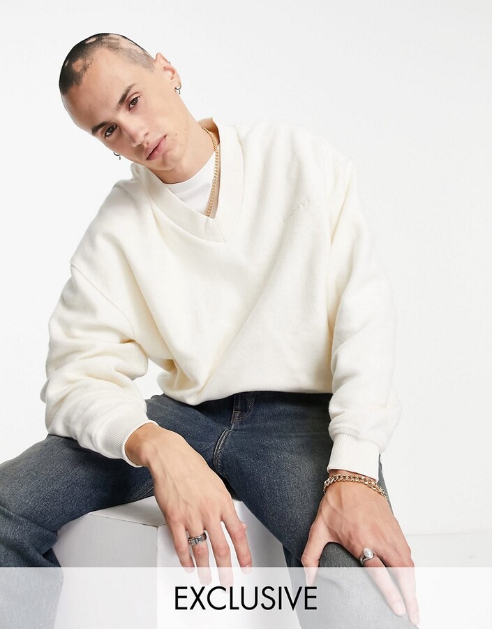 Reclaimed Vintage inspired v neck sweatshirt with chest embroidery