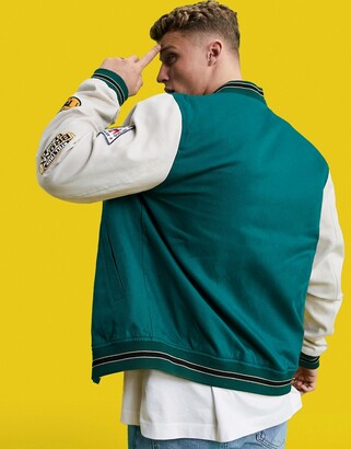 ASOS DESIGN oversized varsity cotton bomber jacket in green with embroidery badging