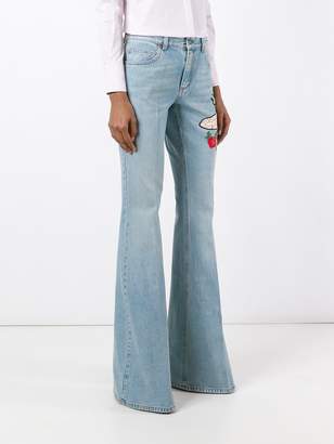 Gucci embroidered flared denim jeans