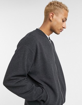ASOS DESIGN longer length oversized jersey bomber jacket in charcoal ribbed fabric
