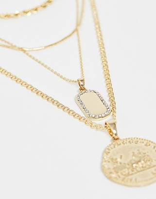 ASOS Design DESIGN multirow necklace with worn coin and crystal detail tag pendants in gold