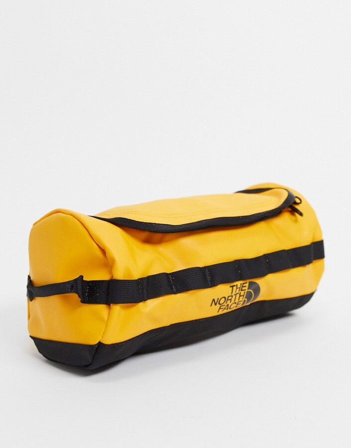 The North Face Base Camp large travel canister wash bag in yellow -  ShopStyle