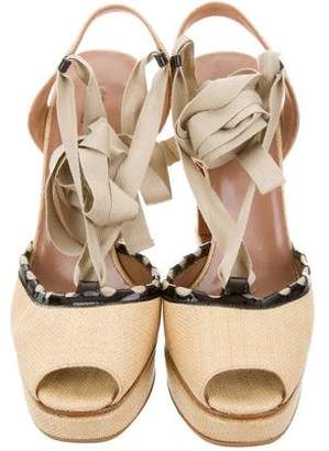 Alaia Fluid Wedge Sandals