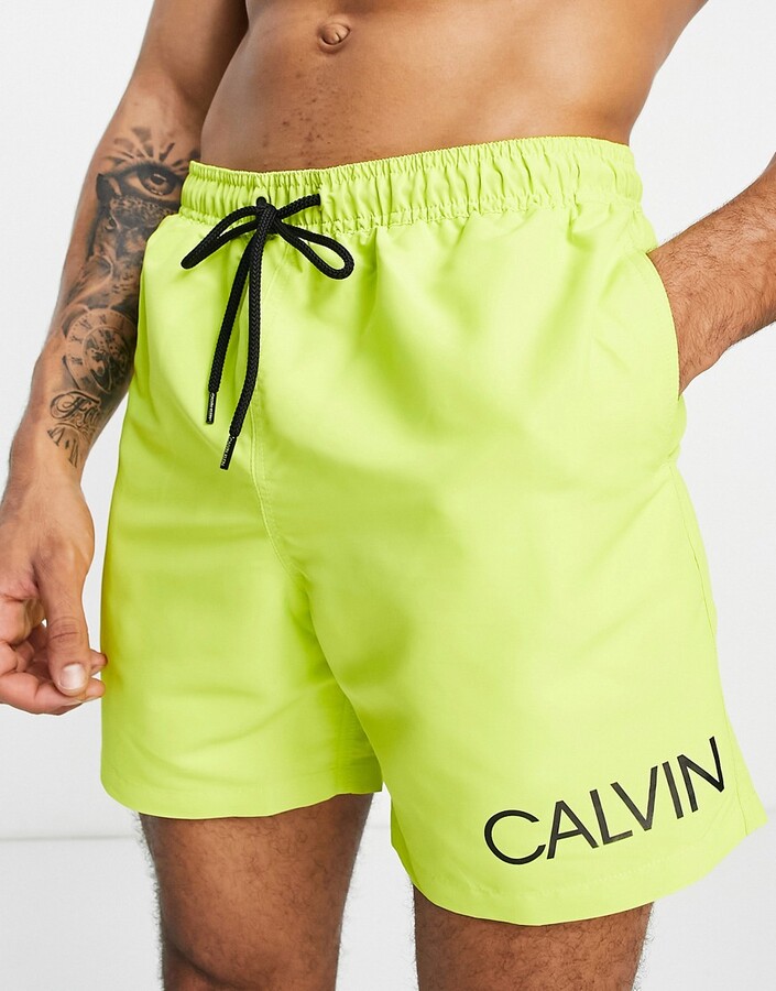 Calvin Klein swim trunks in green - ShopStyle