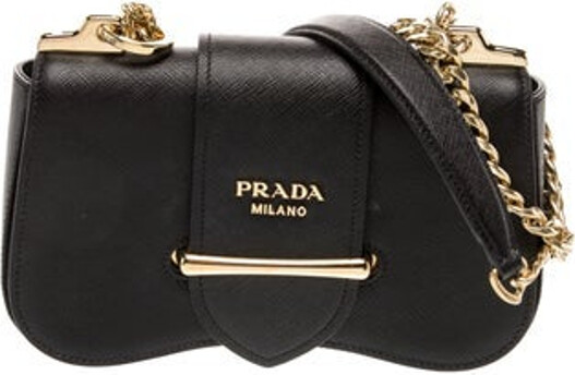 Prada Crossbody Bag Nero Saffiano Lux Leather Saffiano Leather Gold-Tone Hardware Chain-Link Shoulder Straps Chain-Link Accents Logo Jacquard Lining & Single Interior Pocket Pull-Through Closure at Front Includes Dust Bag