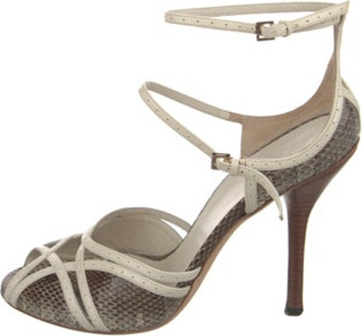 Gucci Snakeskin Sandals Neutrals Animal Print Leather Trim Embellishment Platform Wrap-Around Straps & Buckle Closure at Ankles Unfortunately, due to restrictions, this item may not be eligible for shipping in all areas.