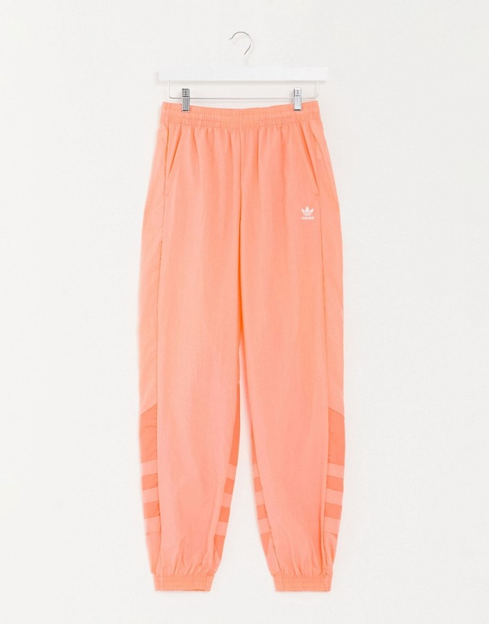 adidas large trefoil track pants in coral - ShopStyle