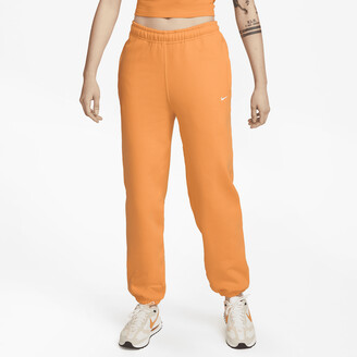 Nike Women's Solo Swoosh Fleece Pants in Orange - ShopStyle