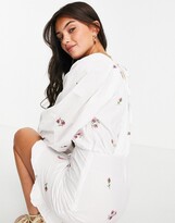 Thumbnail for your product : ASOS DESIGN cotton poplin wrap front mini dress with all over embroidery in white