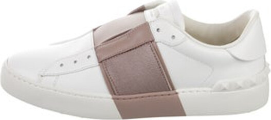 Valentino Leather Slip-On Sneakers White Colorblock Pattern Rockstud Accents Rubber Trim Round-Toes Lace-Up Closure at Uppers Includes Box, Dust Bag & Additional Laces Unfortunately, due to restrictions, this item may not be eligible for shipping in all areas.
