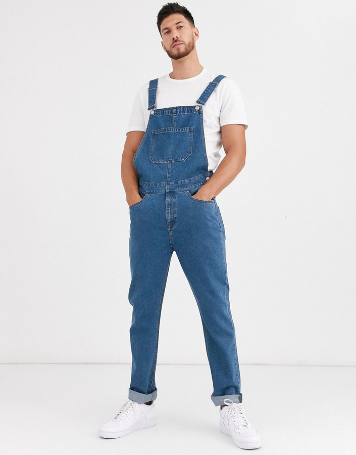 ASOS DESIGN relaxed denim overalls in mid wash blue - ShopStyle Casual Pants
