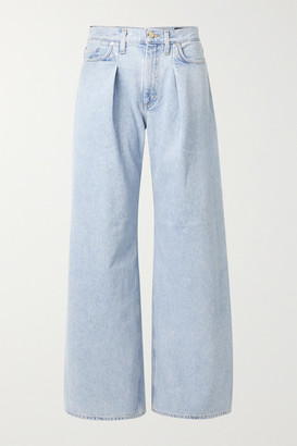 pleated blue jeans