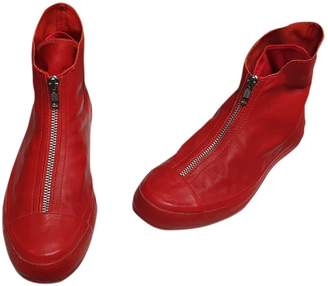 red leather converse trainers