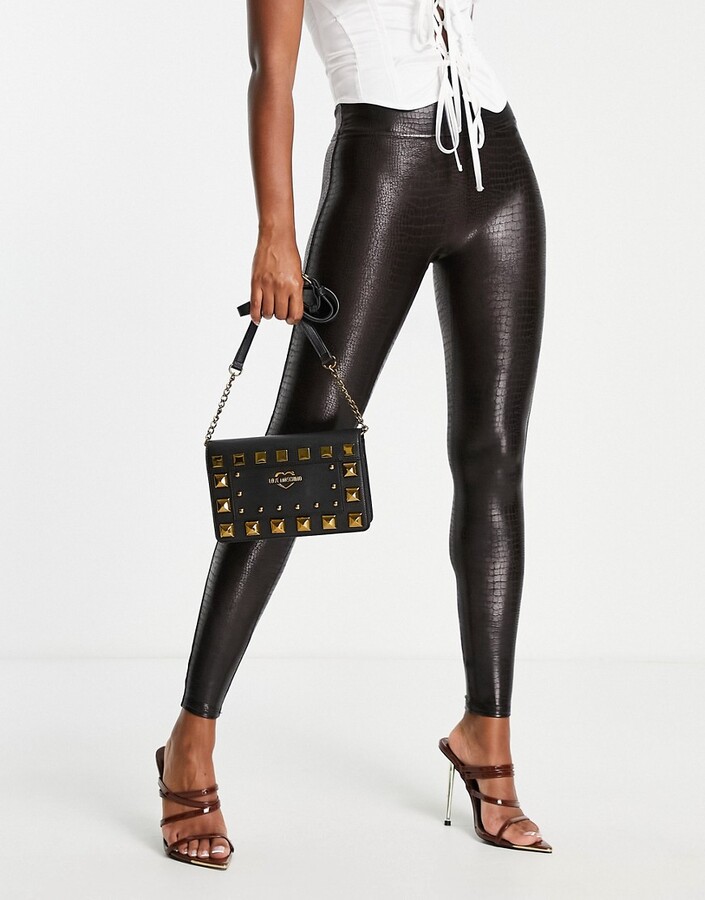 https://img.shopstyle-cdn.com/sim/6b/8d/6b8dd057cc0bc8f7bd023382ca2b2ee3_best/spanx-faux-leather-croc-legging-in-brown-black.jpg