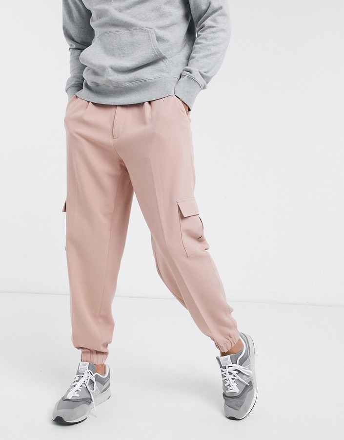 ASOS DESIGN oversized tapered smart sweatpants in pink with cargo pocket -  ShopStyle Pants
