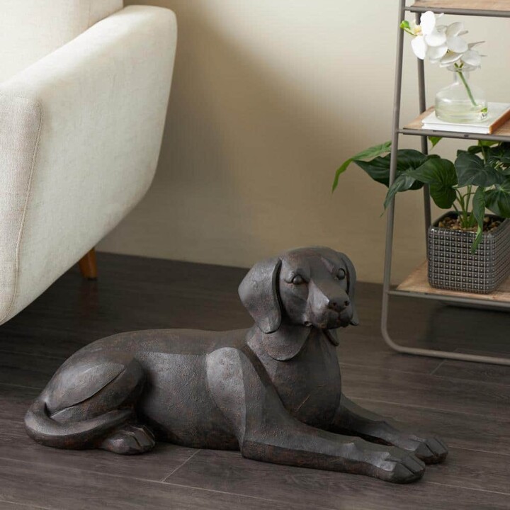 Litton Lane Black Resin Sitting Dog Sculpture with Copper Shadings