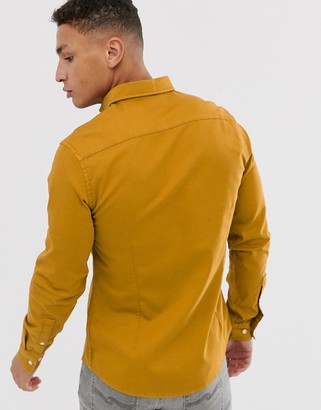 ASOS DESIGN stretch slim denim shirt in mustard