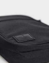 Thumbnail for your product : ASOS DESIGN cross body flight bag in black with branded patch