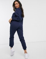 Thumbnail for your product : ASOS Petite DESIGN Petite tracksuit slim sweat / jogger in navy