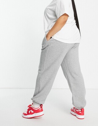 Nike Plus mini swoosh oversized jogger in grey - ShopStyle