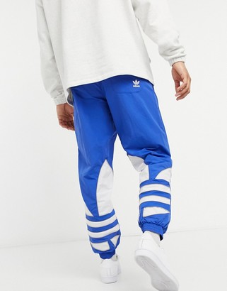 adidas big trefoil woven sweatpants in blue - ShopStyle Activewear Pants