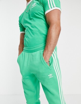 adidas adicolor three stripe joggers in green - ShopStyle Trousers