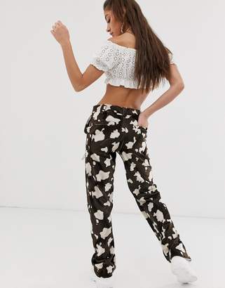 O'mighty O Mighty relaxed trousers in faux fur cow print with chain detail
