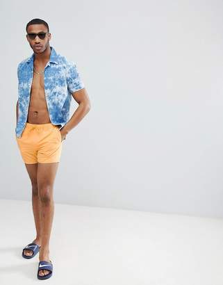 ASOS DESIGN swim shorts in orange in short length
