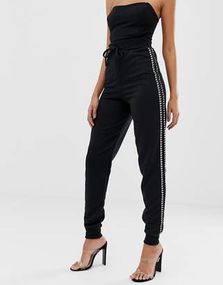 PrettyLittleThing houndstooth side stripe joggers in black