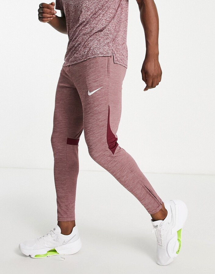Nike Football Academy DriFIT knitted joggers in red marl ShopStyle Trousers