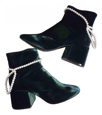 emerald green velvet boots