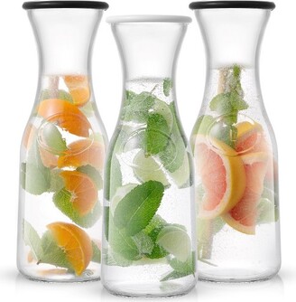 https://img.shopstyle-cdn.com/sim/70/9f/709f3f1bae064e963e8ca70371968727_xlarge/joyjolt-hali-glass-carafe-bottle-water-or-juice-pitcher-with-6-lids-35-oz-set-of-3.jpg