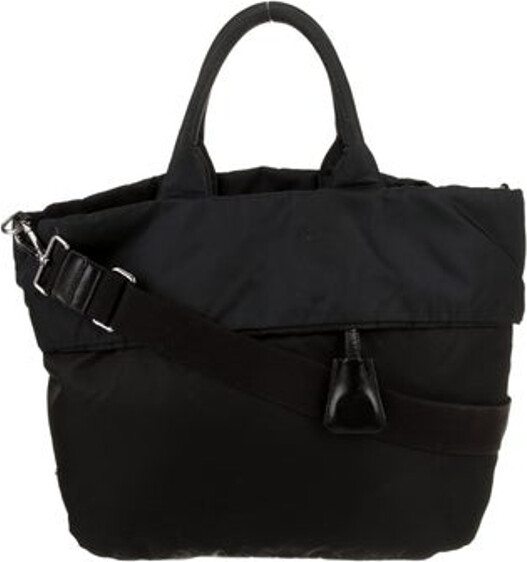 Prada Briefcase Nero Tessuto Tessuto Nylon Silver-Tone Hardware Leather Trim Rolled Handles & Single Adjustable Shoulder Strap Leather Trim Embellishment & Single Exterior Pocket Nylon Lining & Single Interior Pocket Open Top Includes Clochette