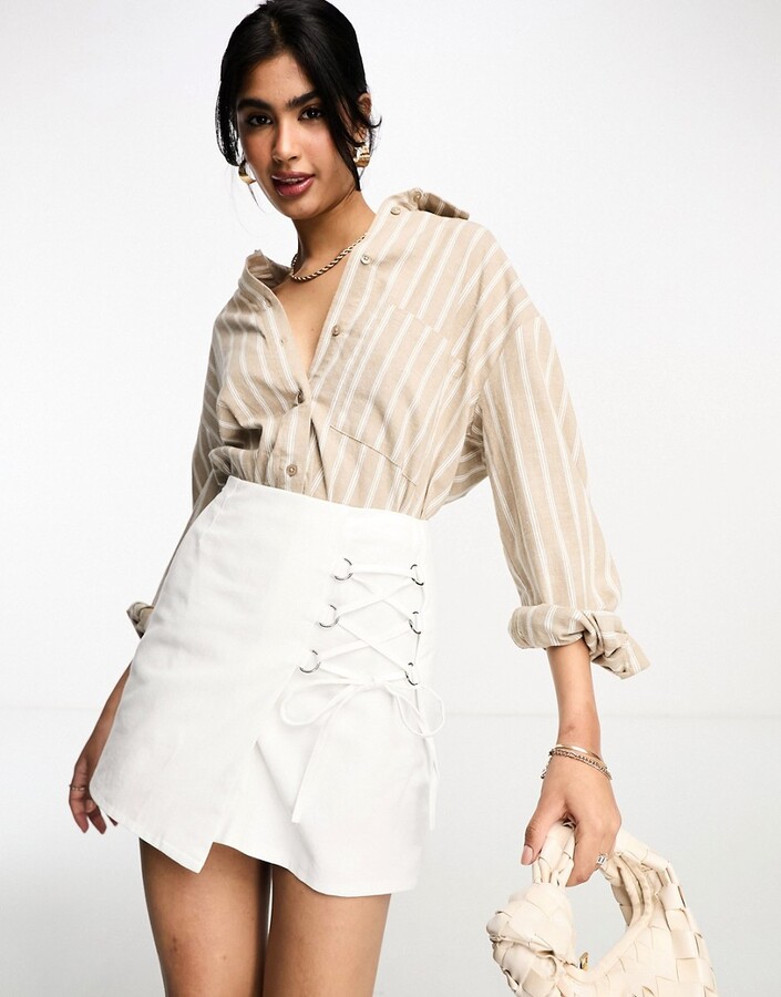 ASOS DESIGN mini skirt with lace up ring detail in white ShopStyle