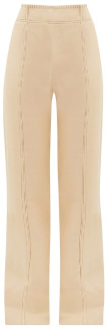 cream flared trousers