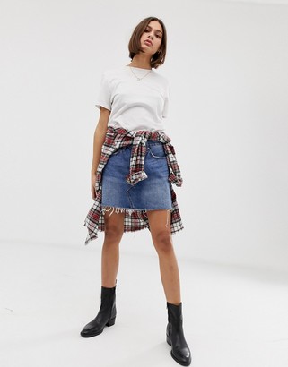 Levi's denim mini skirt with raw hem - ShopStyle
