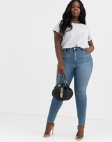 Thumbnail for your product : ASOS Curve DESIGN Curve high rise ridley 'skinny' jeans in pretty mid stonewash